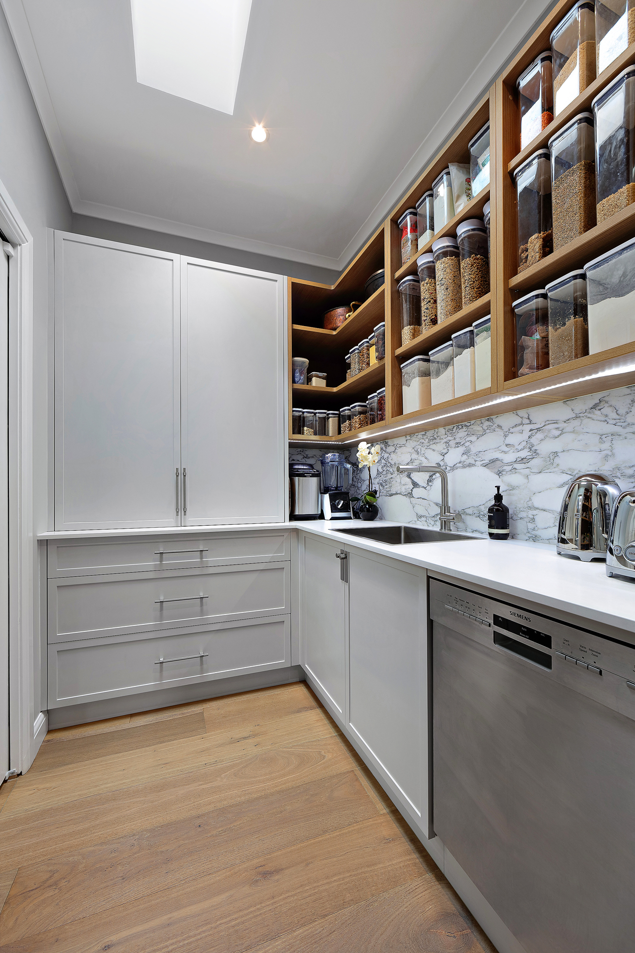 Scullery design -White cabinets, wooden shelves for spices and Siemens Dishwashing machine
